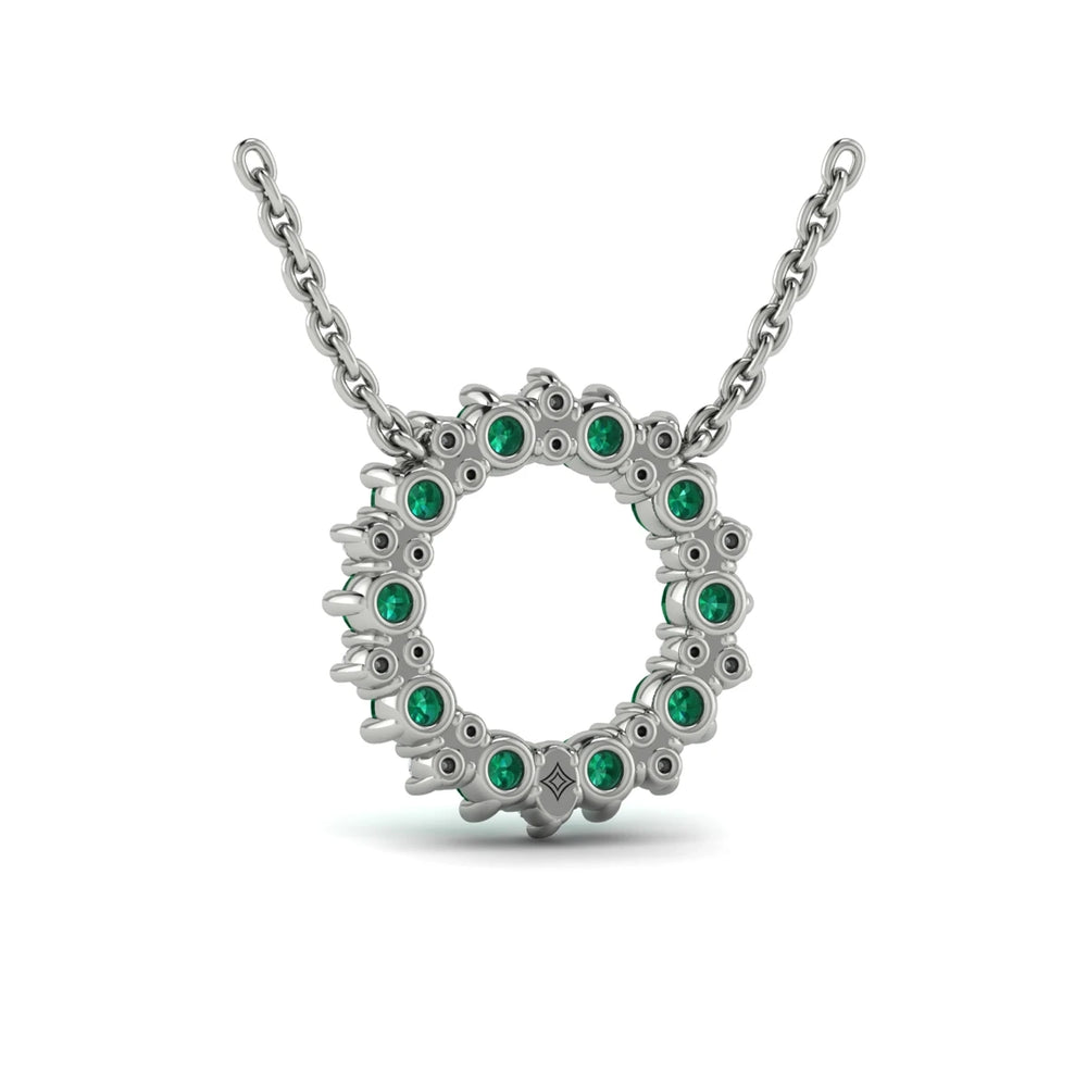 Diamond and Emerald Open Starburst Circle Pendant Necklace White Gold