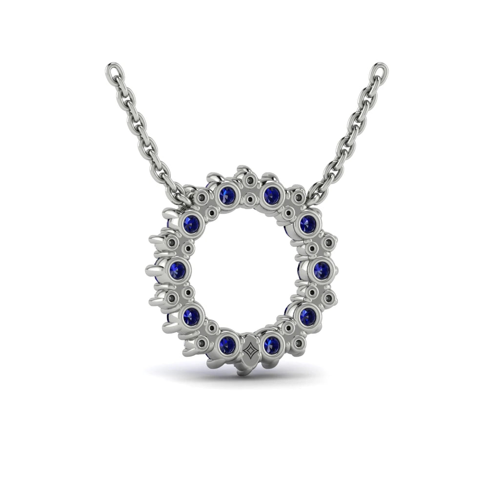 Diamond and Blue Sapphire Open Starburst Circle Pendant Necklace Platinum