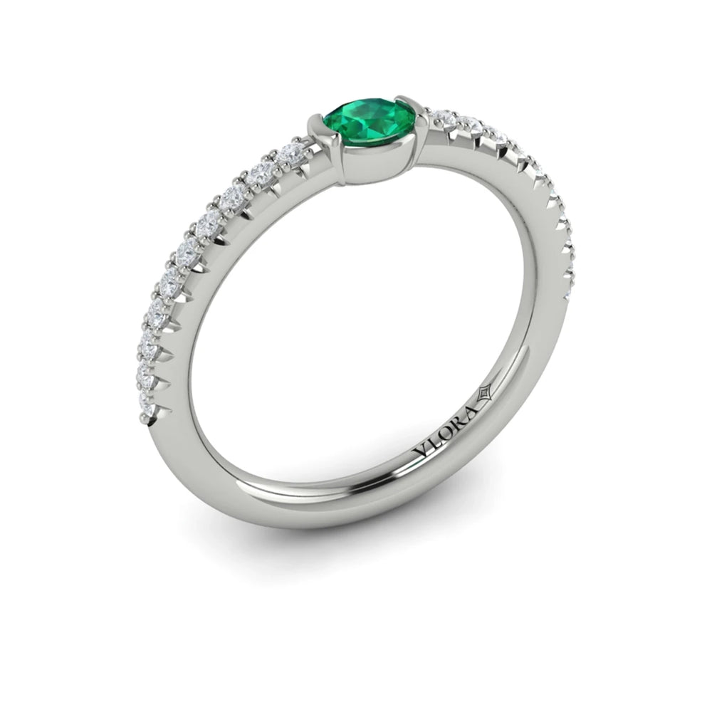 Diamond and Oval Emerald Centerstone Ring White Gold